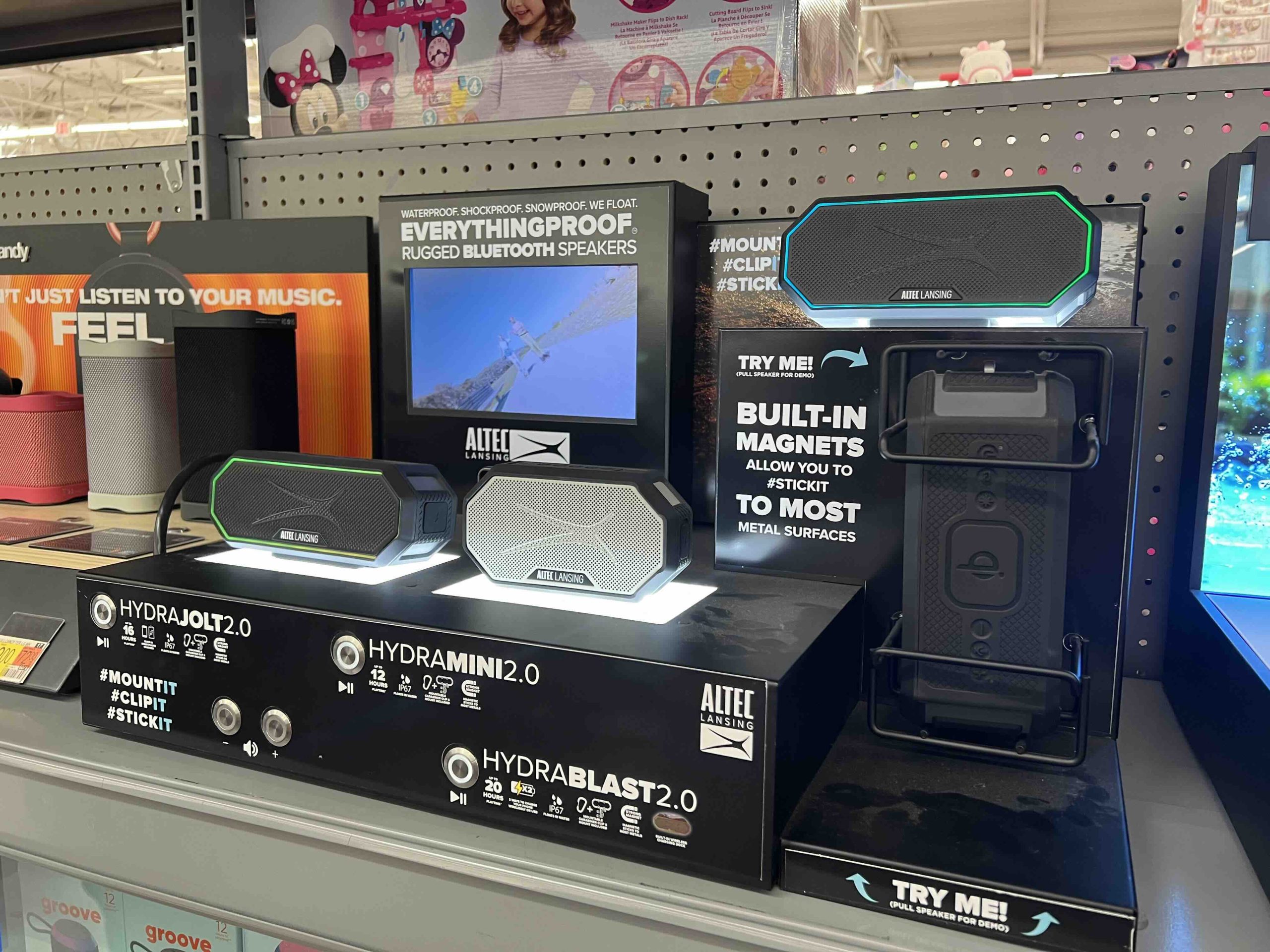 Smart audio product experience zone with interactive display in electronics retail store